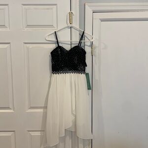 New with tags!  Size 3 black and white dress. Gorgeous rhinestone top.
